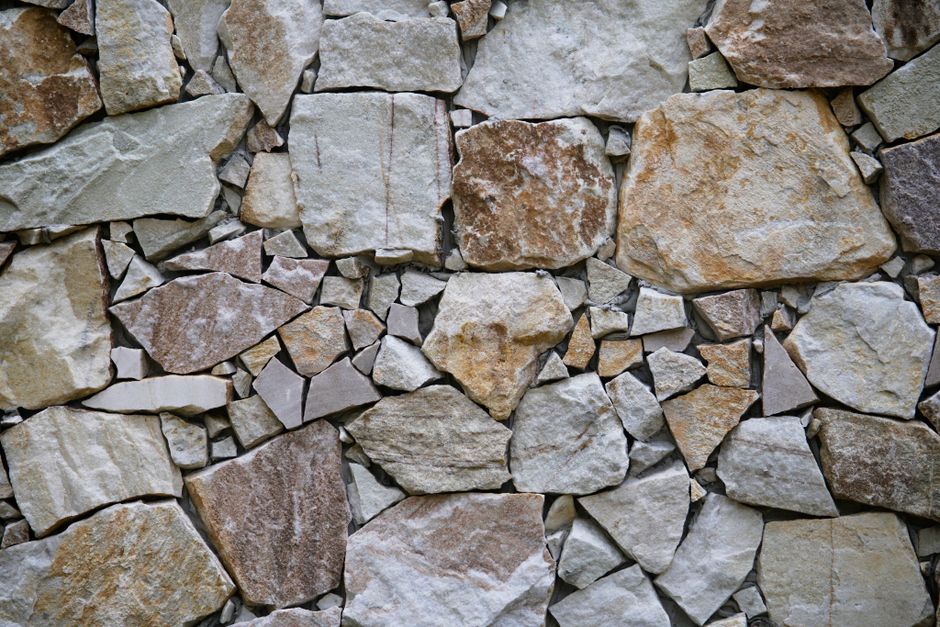 Stone masonry wall under construction